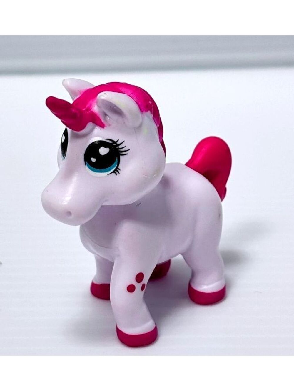 Small Pink and White Plastic Unicorn Figurine Toy with Blue Eyes